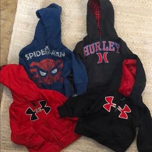 Four 12 month zip up hoodies